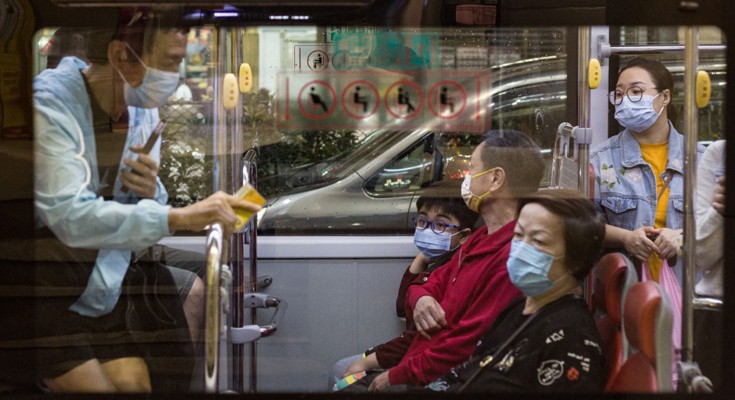 Passengers wearing masks on a bus in Macao, China.