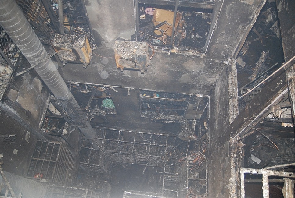 Stack effects in tall building fires: a case study of Taiwan old apartment  fire