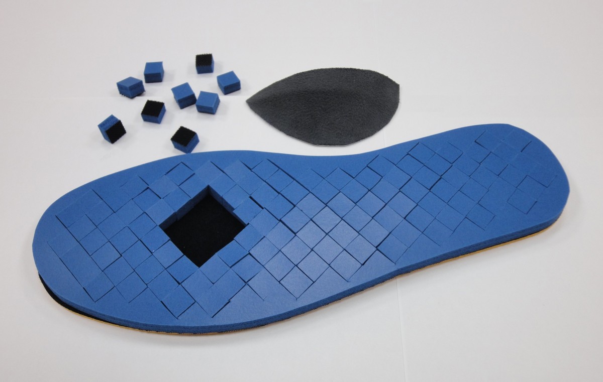 The effect of removing plugs and adding arch support to foam based insoles on plantar pressures