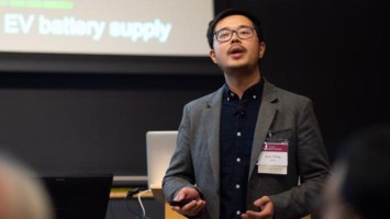 Researcher Sean Zheng gives a lecture to an audience.