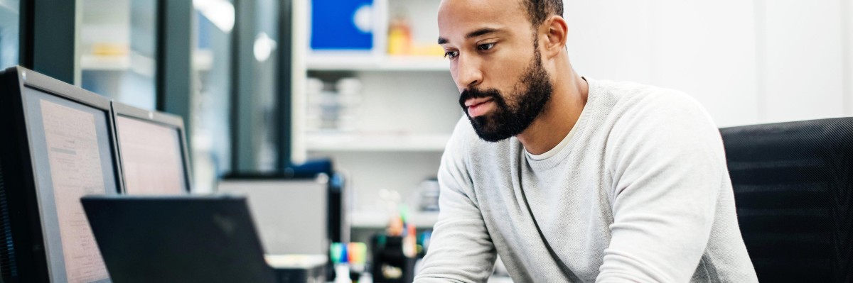 A scientist looks at his laptop