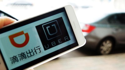Logos Didi und Uber auf Smartphone-Display