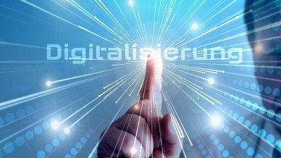 Ein Finger tippt auf das virtuelle Wort Digitalisierung