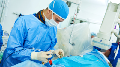 Surgeon performing catheter-based procedure