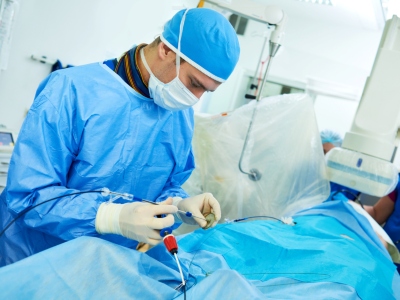 Surgeon performing catheter-based procedure