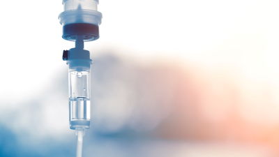 IV drip on a blue and pink background
