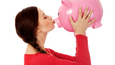 Frau mit Sparschwein