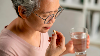 Woman taking pill