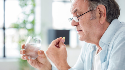 Man taking a pill