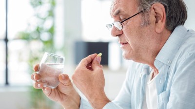 Man taking a pill