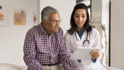 Older man in discussion with a doctor