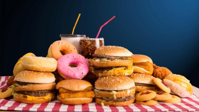 A photograph of fast food and drinks