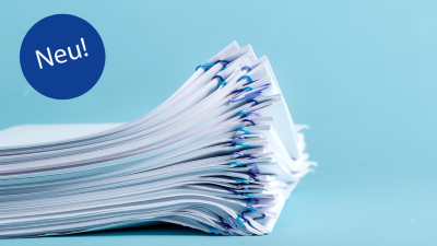 Pile of papers organized with paper clips