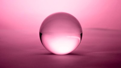 Crystal ball on pink background