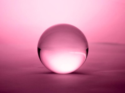 Crystal ball on pink background