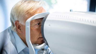 Man undergoing retinal eye exam