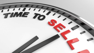 A clock hand points to eleven o'clock on the words “Time to sell.”