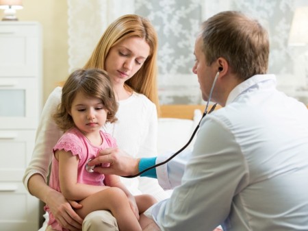 Child at doctors with parent