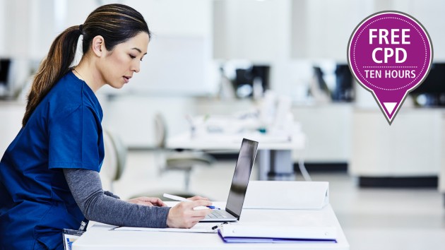 health professional with laptop