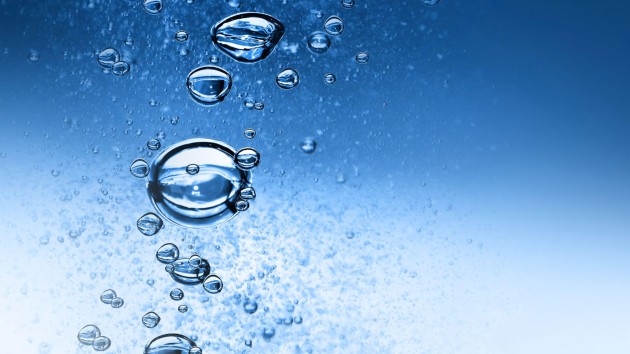 Oxygenated bubbles rising to the service in a liquid