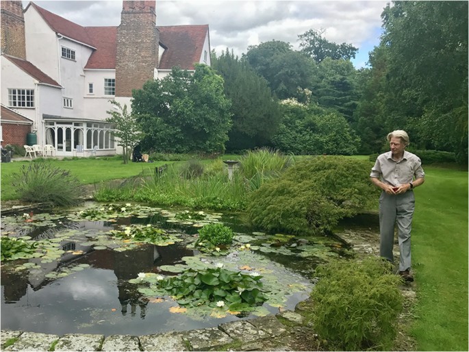 Fig. 3: John in his garden at the pond during a lab lunch.