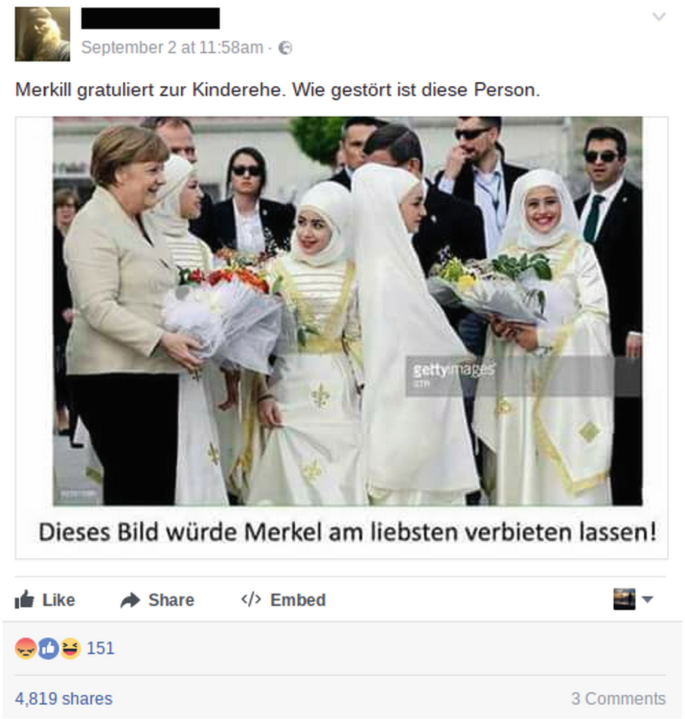 A tweet with a photograph of Angela Merkel presenting bouquets to the children dressed in hijabs. 5 men and a women watch from the back.