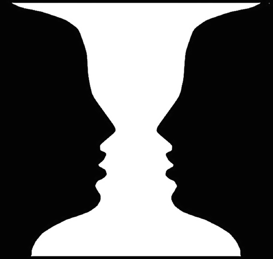 An image of an optical illusion. It has two faces facing each other and at the same time, an image of a goblet.