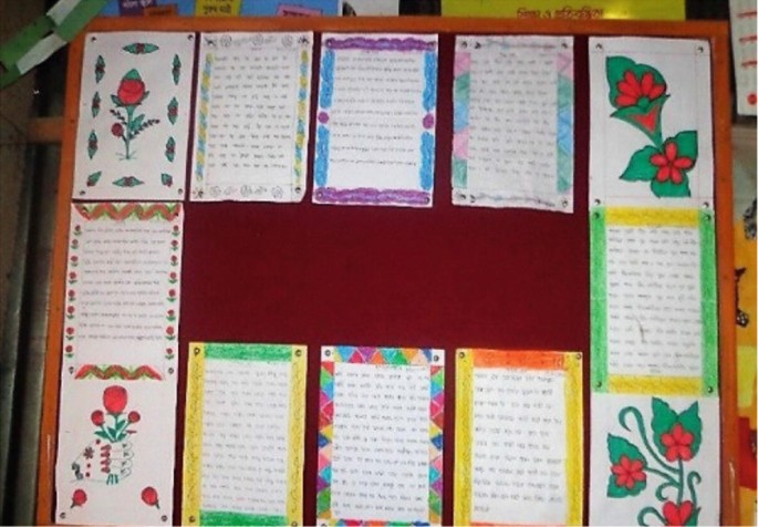 A photo displays a bulletin board with 12 decorative cards. There are 5 cards in both the first and last rows, and one card each at the end of the middle row.