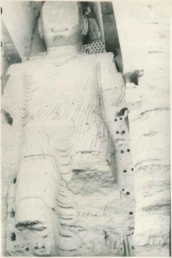 A photograph of the 55-meter-high statue of Dīpaṃkara Buddha of Bamiyan.