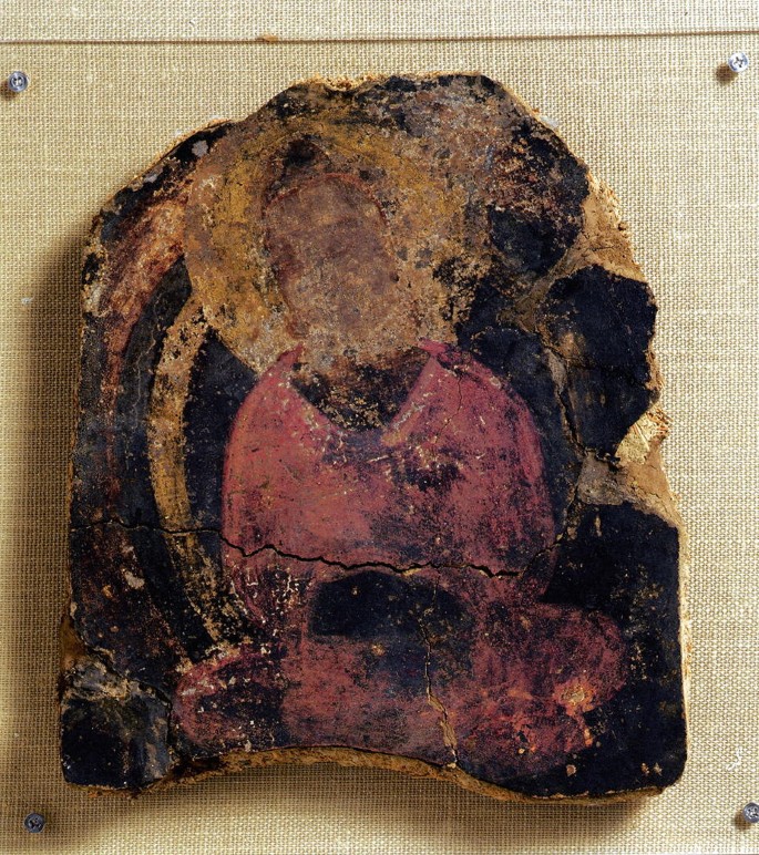 A photograph depicts a fragment of protected art from cave E.