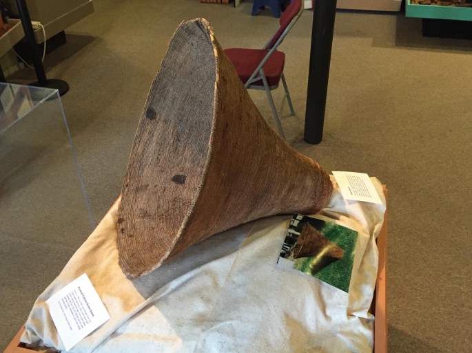 A conical basket on a table.