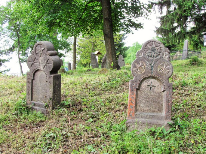 Photograph of two Epitaphs made of stone with carvings.