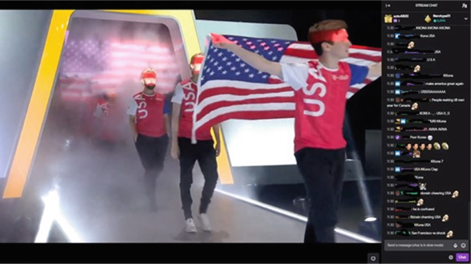 A screenshot of U S A's team members who enter the stage. Their captain carries a large flag over his shoulders. To the right of the screen is the list of comments.