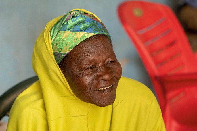 A photograph of an elderly woman with a smile on her face.