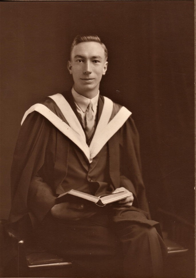 A photograph of Joe Pawsey in his graduation gown.