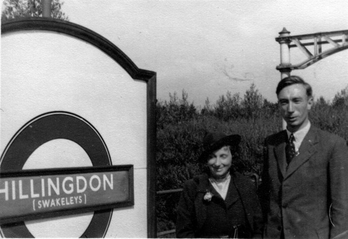A photograph of Joe Pawsey and Lenore Pawsey next to a signboard reading Hillingdon.