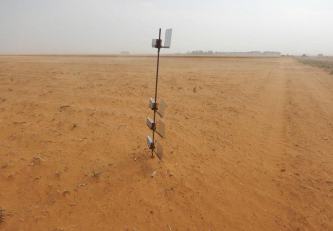 A photograph of a dust trap in a barren land.
