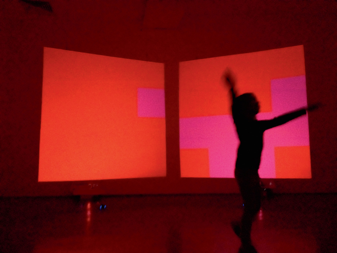 A photograph of the Shaping Form works at the Site Gallery in Sheffield depicts a moment in the interaction with its installation version Shaping Space.