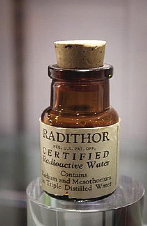 A photograph of a bottle of Radithor, certified radioactive water, closed with a cork.