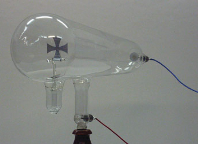 A photograph of a cathode ray tube connected to wires and attached to smaller tubes.