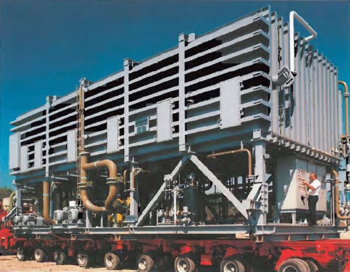 A photograph of a large Caribbean M V C which is kept on a truck with many wheels.
