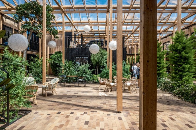 Agorhaverne green house communal area is designed as the central core of public life, offering multipurpose spaces organised within a grid of timber columns.