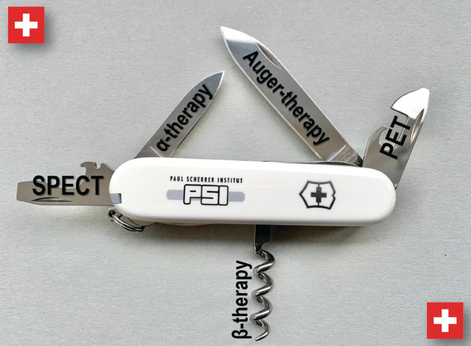 A photo of a pocket knife with varied shaped knives for SPECT, PET, alpha therapy, Auger therapy, and for beta therapy a cock screw like tool is used.