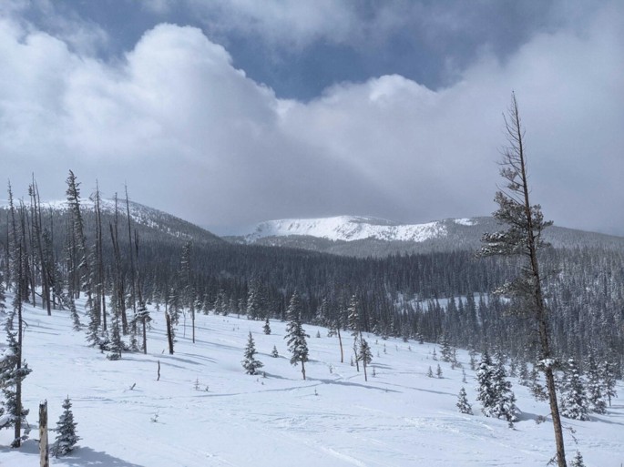 A photograph of the snow-covered Rocky Mountains.