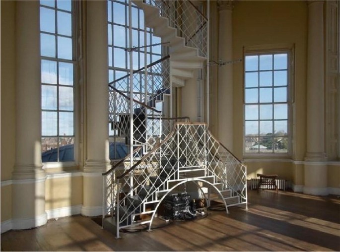 A photograph of an ornate and elegant spiral staircase inside the Radcliffe Observatory, featuring intricate ironwork and a graceful design.