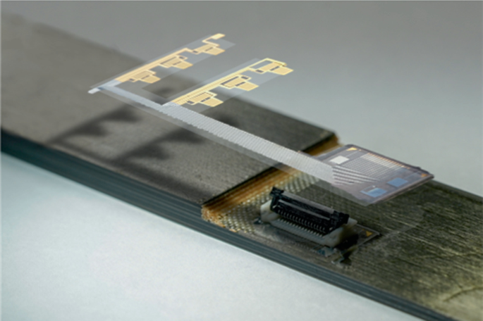 A photograph of a sensor inlay. It has chips for detection.