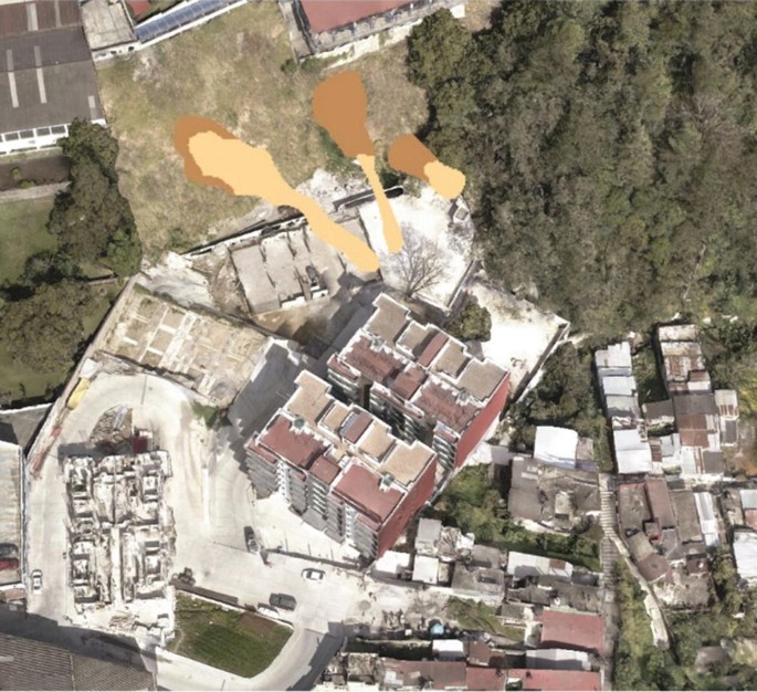 An aerial photograph of several buildings in a highly susceptible area.
