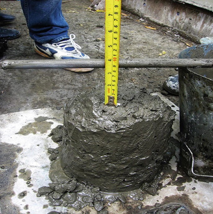 A photograph features the decrease of the concrete slump against the height of a set form.