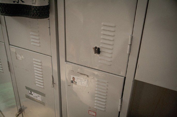 A photo of a locker damaged by a bullet hole.