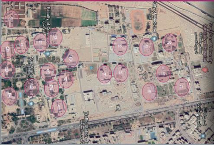 A satellite view highlights the different faculties in the Suez Canal University labeled from 1 to 21.